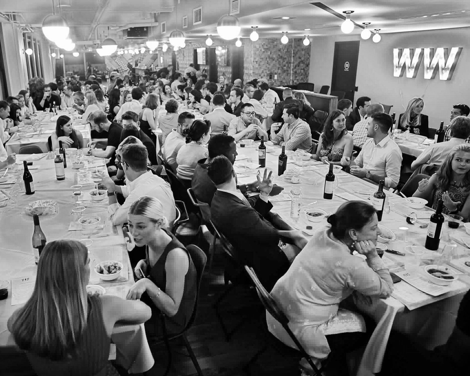 Guests gathered around a 7:47 dinner table